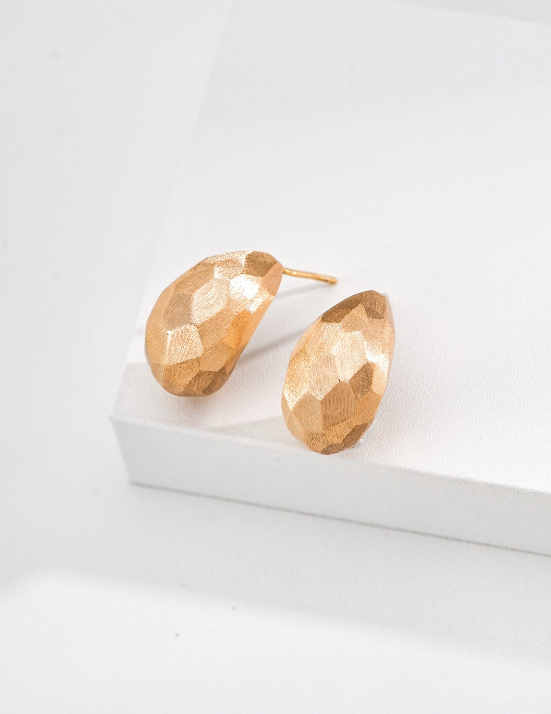 Sterling silver earrings with faceted cuts and hand‑filed textures, delivering bold architectural‑sculptural vibes.