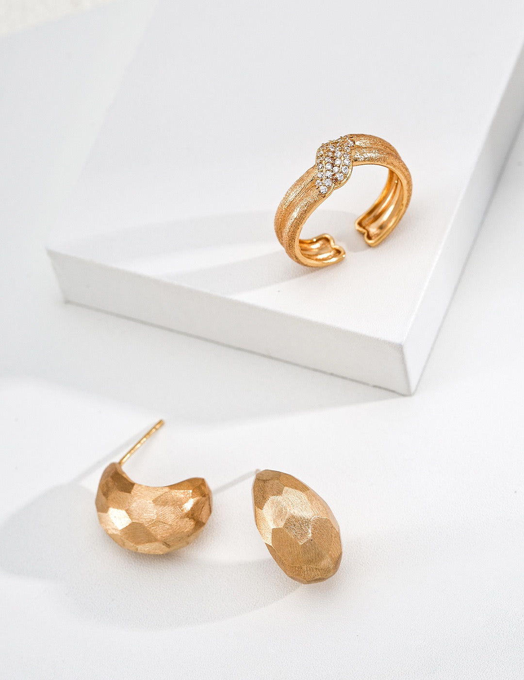 Sterling silver earrings with faceted cuts and hand‑filed textures, delivering bold architectural‑sculptural vibes.