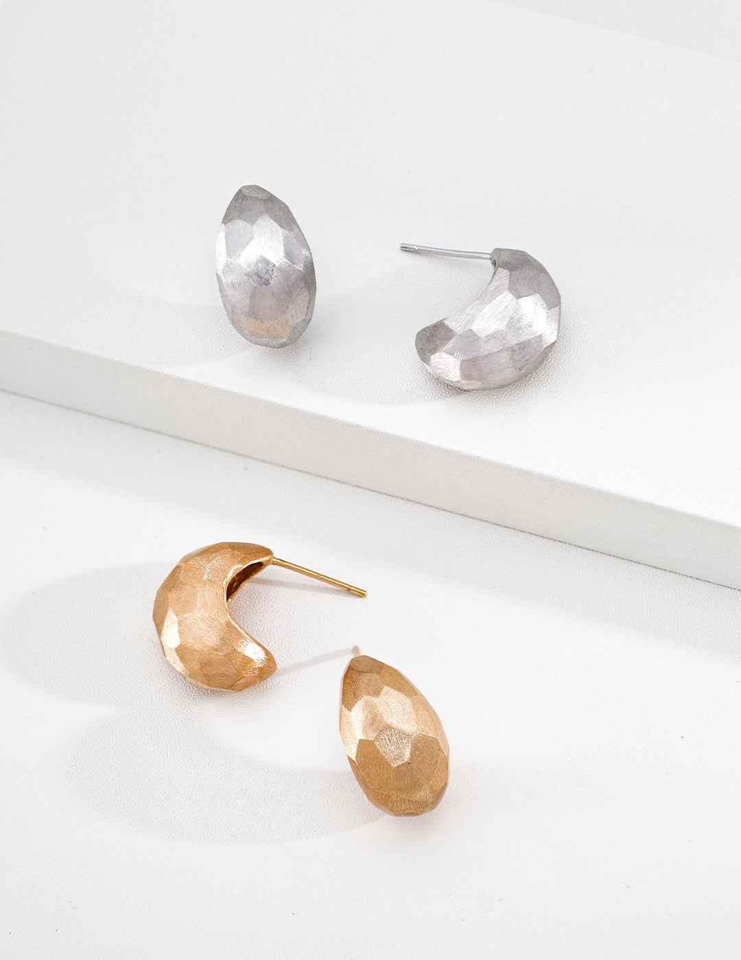 Sterling silver earrings with faceted cuts and hand‑filed textures, delivering bold architectural‑sculptural vibes.